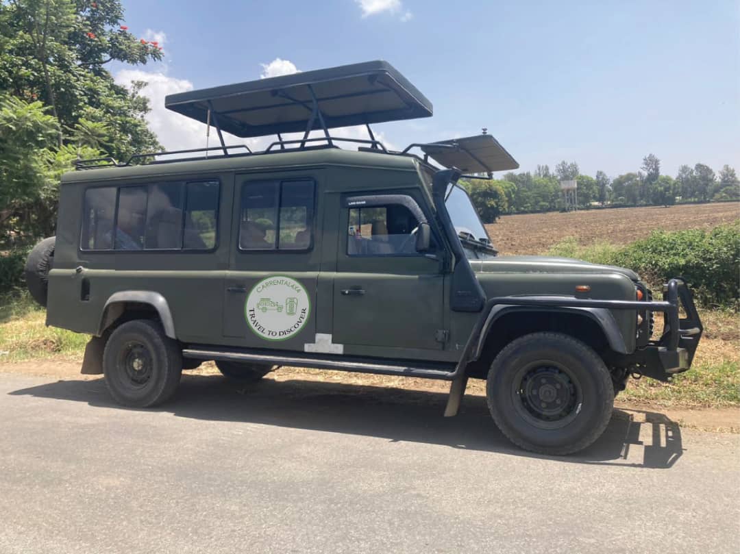 safari vehicle for game drive in Kenya with a driver